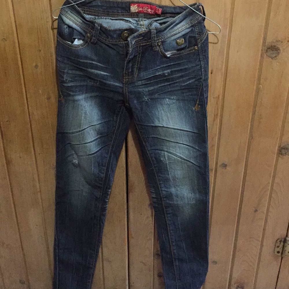 Distressed dark washed skinny jeans